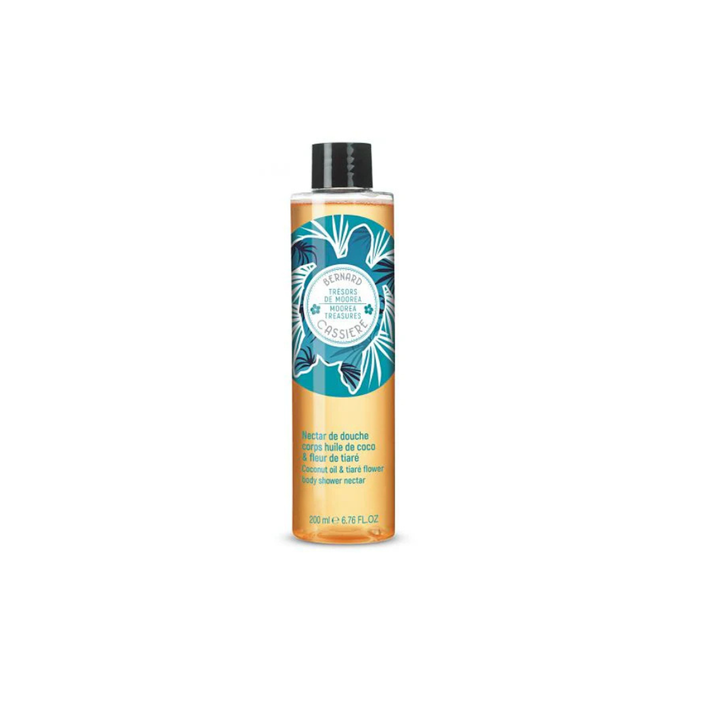 A bottle of Bernard Cassiere Paris shower gel in  coconut oil and tiare flower scent, featuring a vibrant orange and teal tropical floral label with a black cap, set against a plain white background.